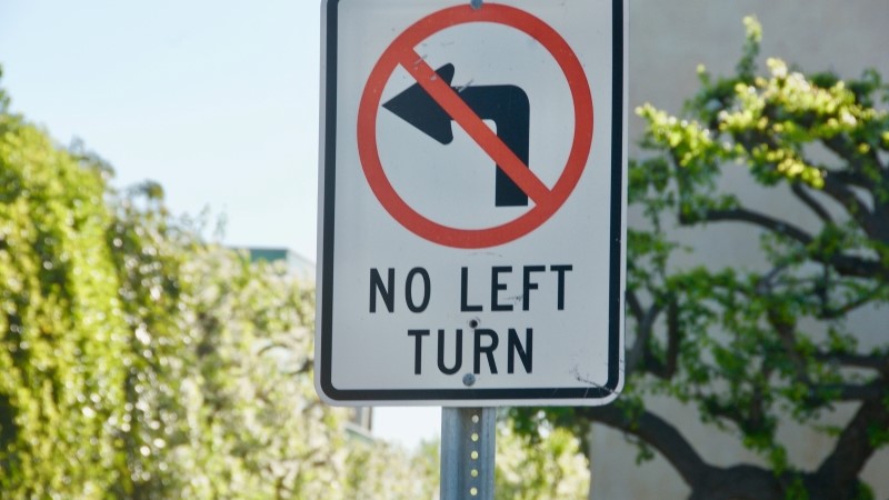 No left turn sign crossed circle over left turn arrow Malibu California