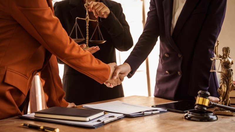 Shaking hands, Lawyers offer legal guidance,