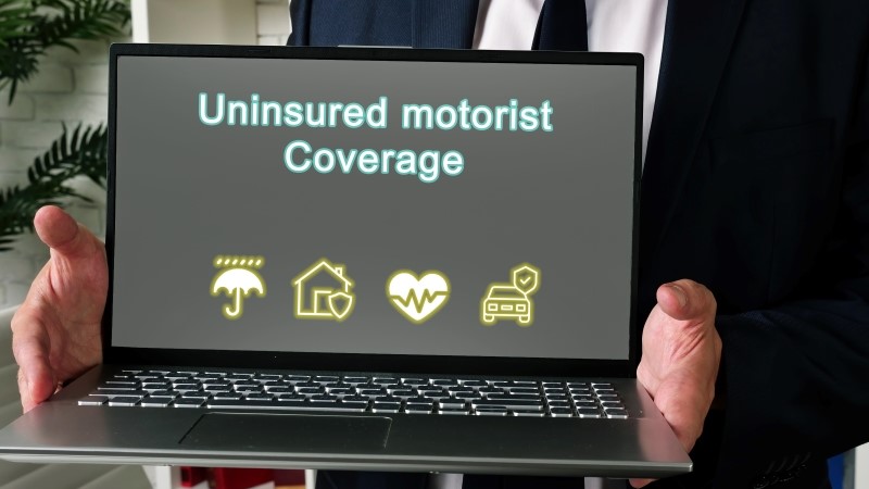 Business concept meaning Uninsured motorist Coverage with phrase on the page.