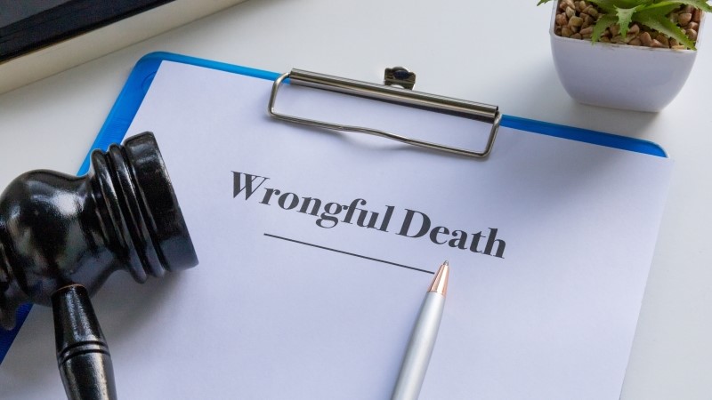 A professional and somber image of a wrongful death document in a clipboard,