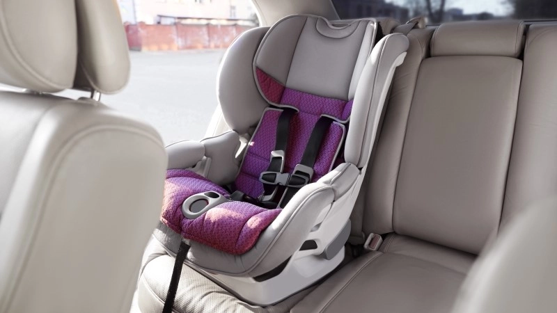 Empty modern child safety seat inside car