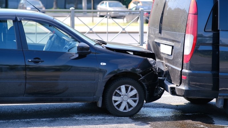 Auto accident involving two cars on a city street
