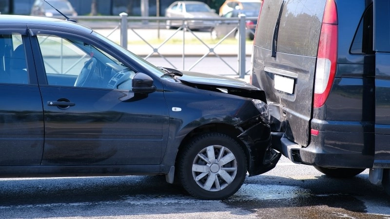 Auto accident involving two cars on a city street