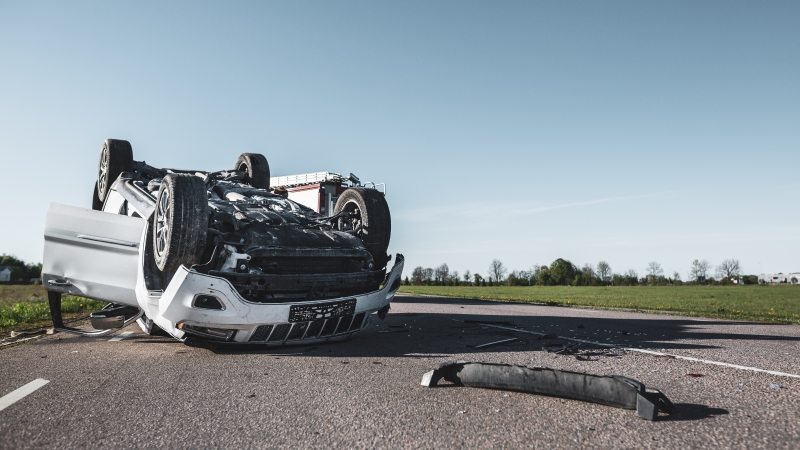 Daytime Crash Scene with Damaged Car.