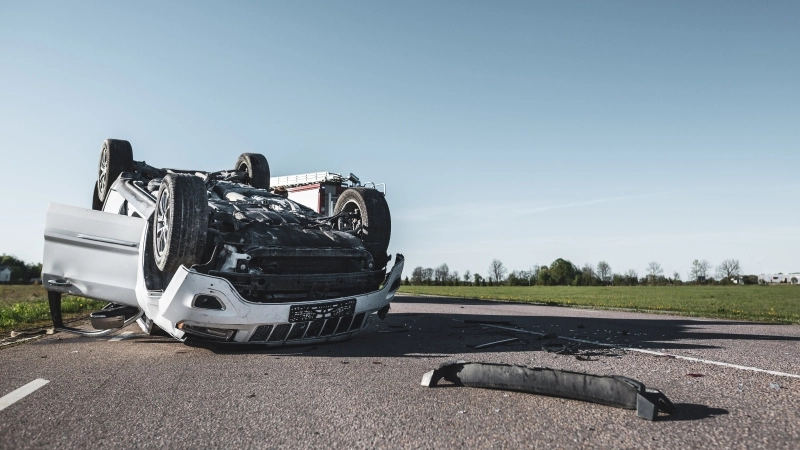Daytime Crash Scene with Damaged Car.