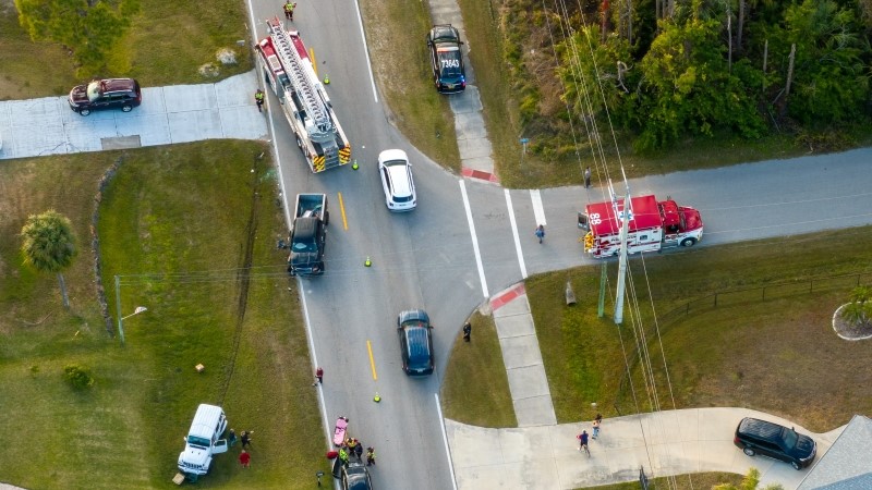 Car hit cyclist accident on city street in Florida. Result of distracted driving and speeding.