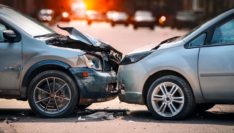 Cars crash accident on the street. Damaged automobiles. Car Insurance Concept
